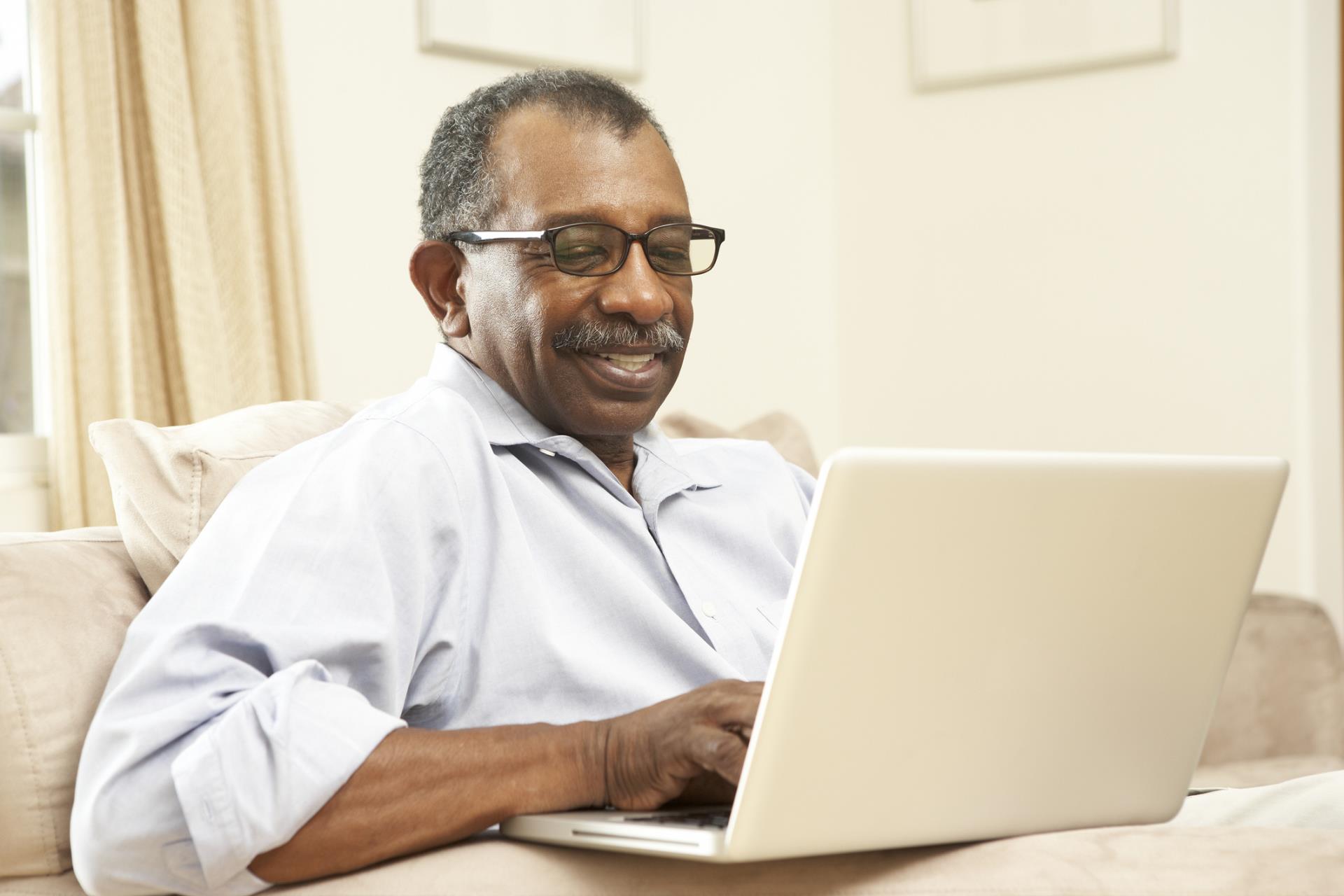 Older black male on computer