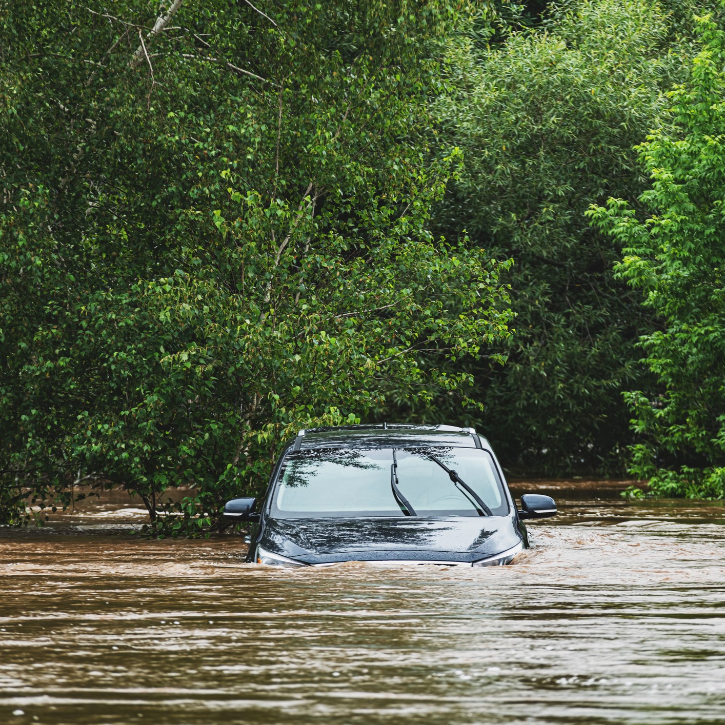 car stuck in flood waters