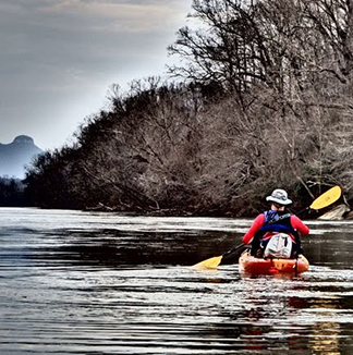 Kayaking the Yadkin River with Pilot Mountain in the distance